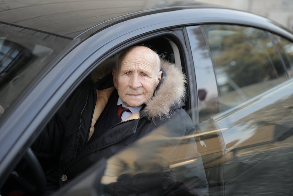 Best car insurance for seniors quote review: focused senior man driving his car in good weather, the calm low-mileage profile that wins the best car insurance for seniors pricing tier with most carriers