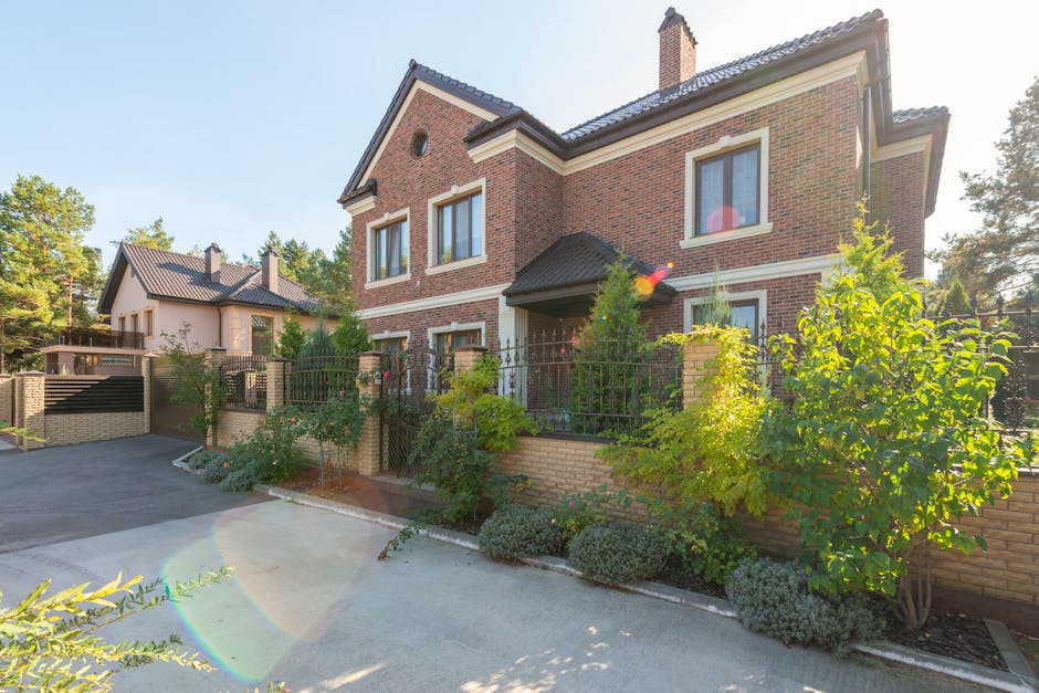 HELOC rates today suburban context: a well-kept single-family home with a paved driveway and a manicured lawn on a sunny day, the kind of primary-residence property profile that consistently anchors the most competitive HELOC rates today across the national lender market