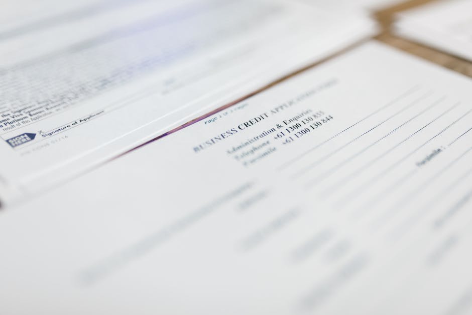 Term life insurance quotes paperwork detail: a close-up of a life insurance application document and stethoscope on a wooden table, the standard medical paperwork that drives every carrier's health-class decision and ultimately every term life insurance quotes outcome on identical coverage
