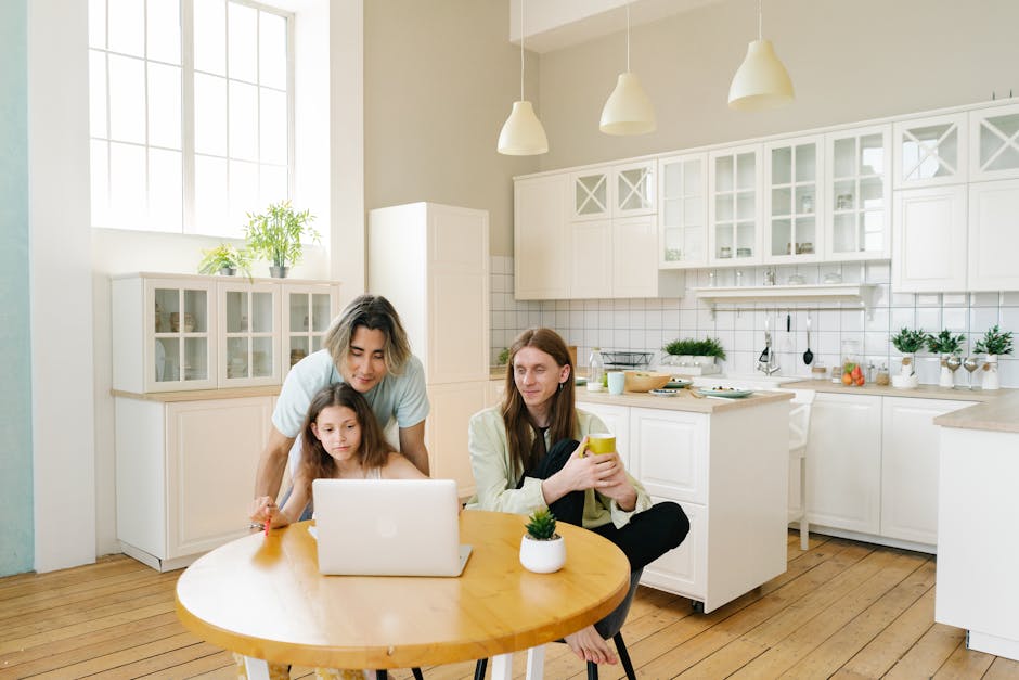 Term life insurance quotes household planning context: a young family of three sharing time together in a bright modern kitchen, the kind of dependent household profile that makes pulling accurate term life insurance quotes the single highest-leverage hour on the annual financial calendar