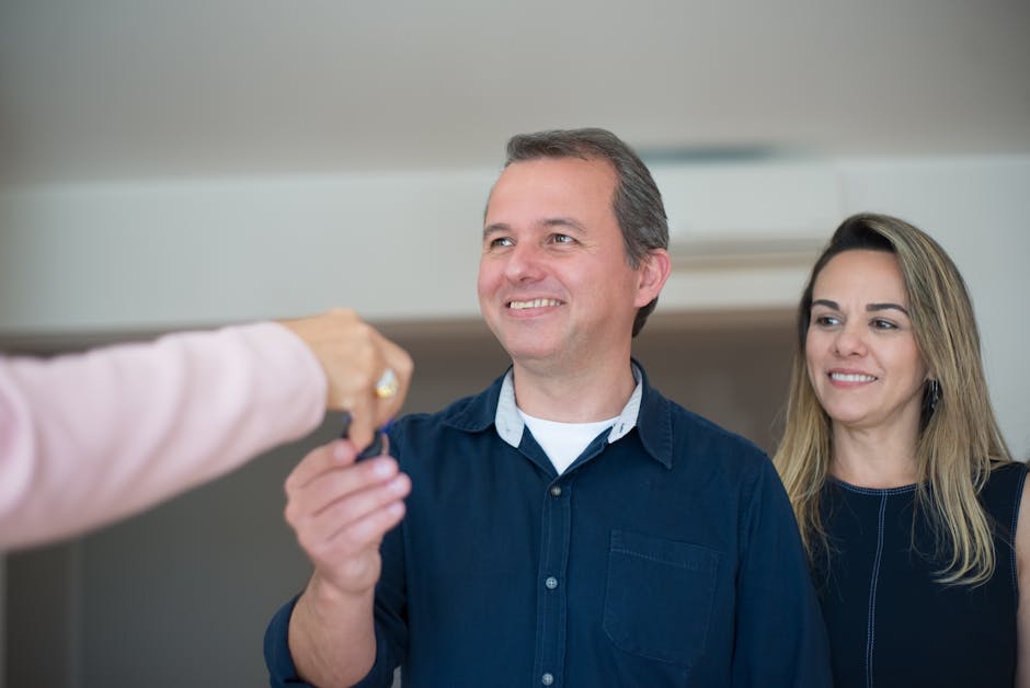 VA home loan rates outcome: a smiling couple receiving the keys to their new home, the closing moment the best VA home loan rates and zero down payment make possible