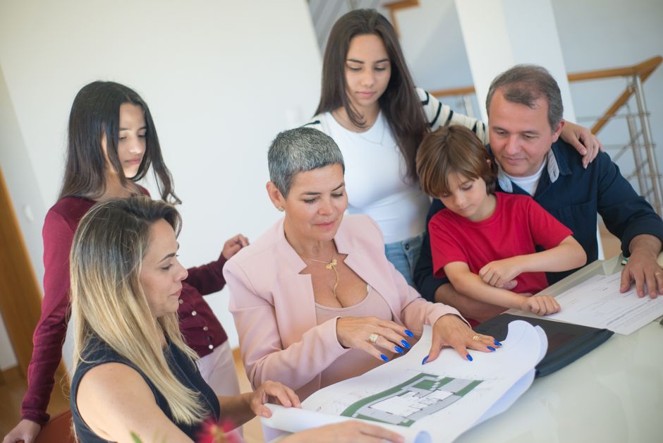 Family reviewing whole life insurance quotes at a kitchen table
